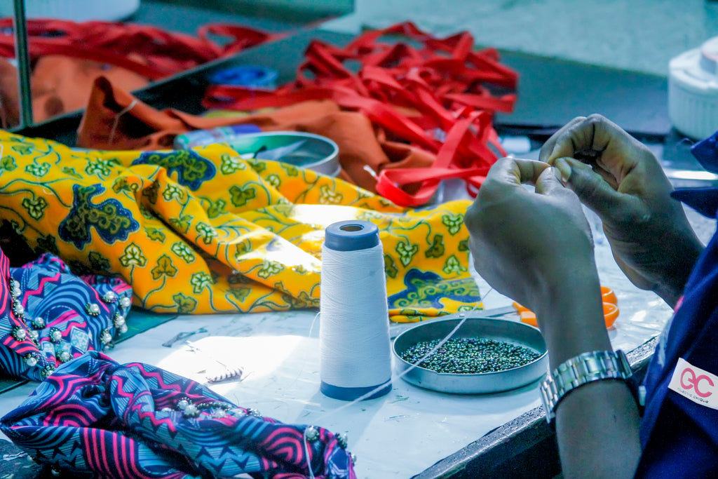 image of artisan sewing